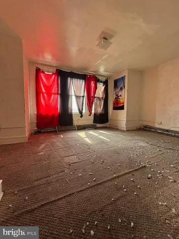 a room with gym equipment and windows