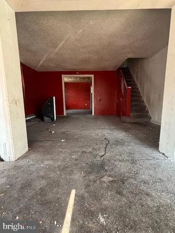a view of an empty room with a fireplace