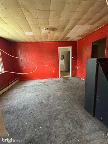 a view of an empty room and window