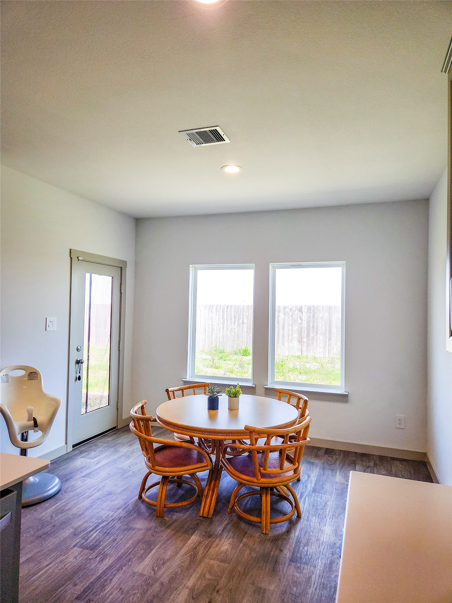 7219 Sunbreeze Lane Rosenberg, TX 77469 - Photo 11 of 18 a dining room with wooden floor and a window