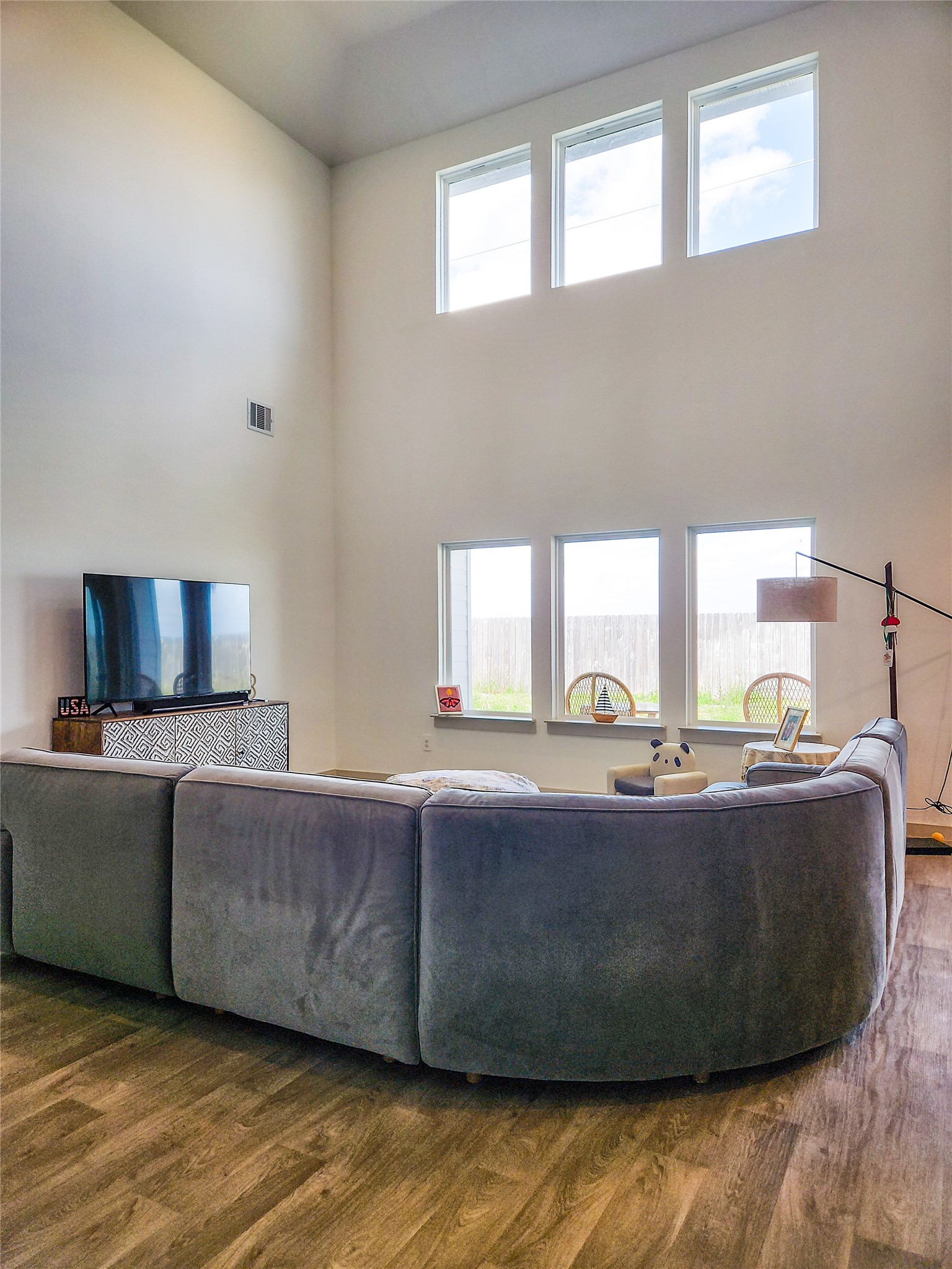 7219 Sunbreeze Lane Rosenberg, TX 77469 - Photo 3 of 18 a living room with couches and a flat screen tv