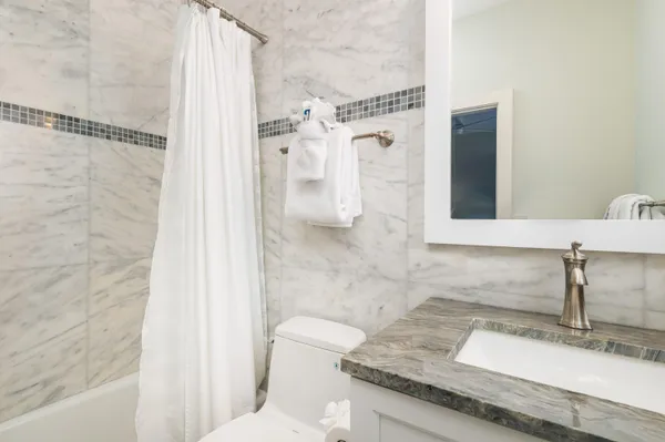 a front view of a building with a garden