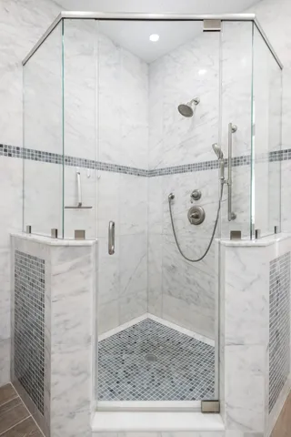 a bathroom with a toilet and a shower