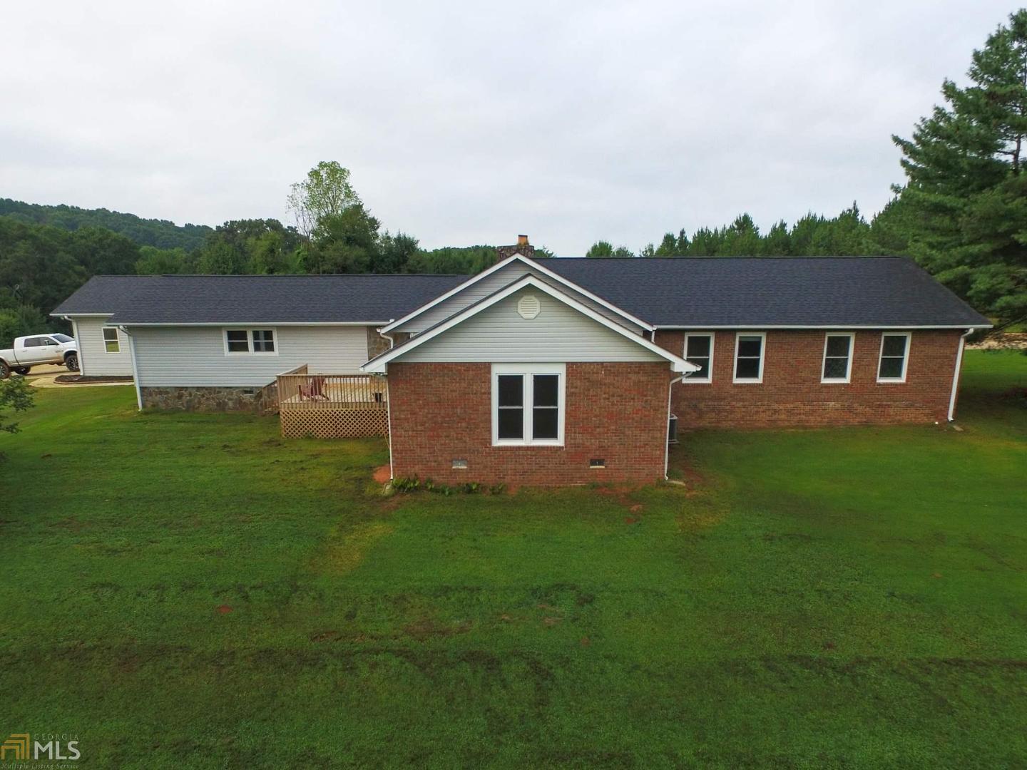 7355 Royston Road Carnesville, GA 30521 - Photo 1 of 1 a front view of a house with a yard