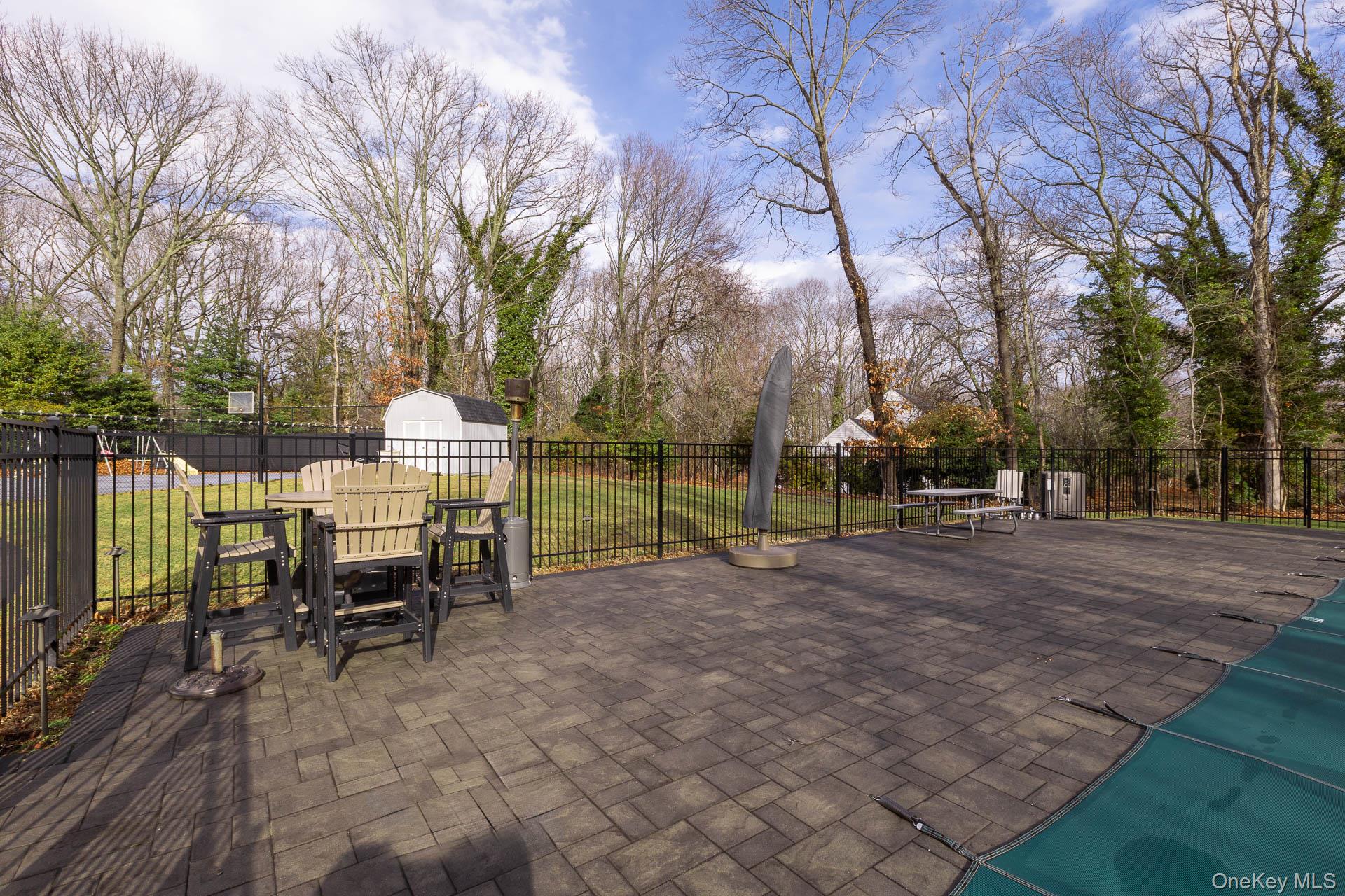 83 Cliff Road Port Jefferson, NY 11777 - Photo 13 of 50 a view of a house with backyard and a trees