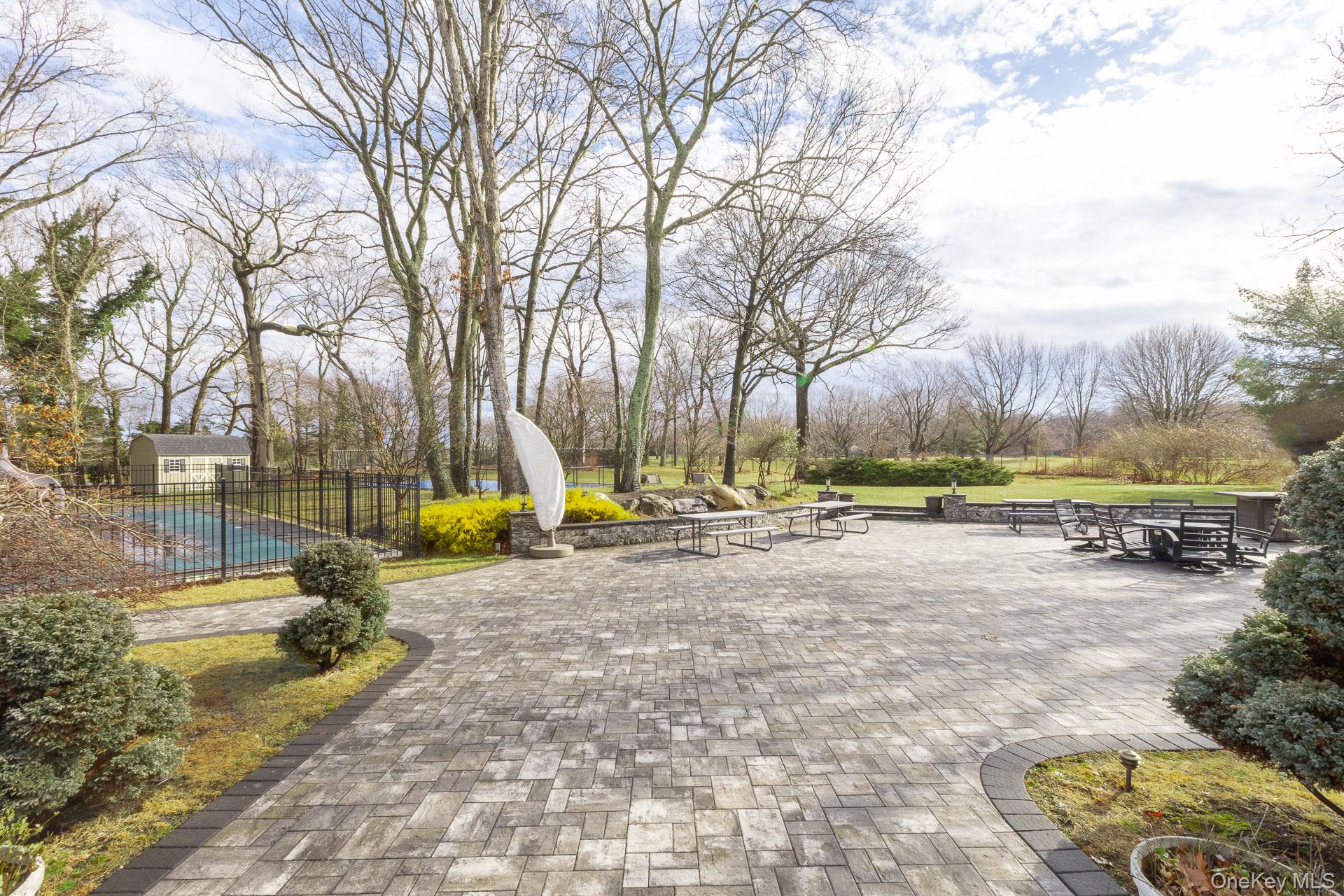 83 Cliff Road Port Jefferson, NY 11777 - Photo 16 of 50 a view of a park with swings and slides