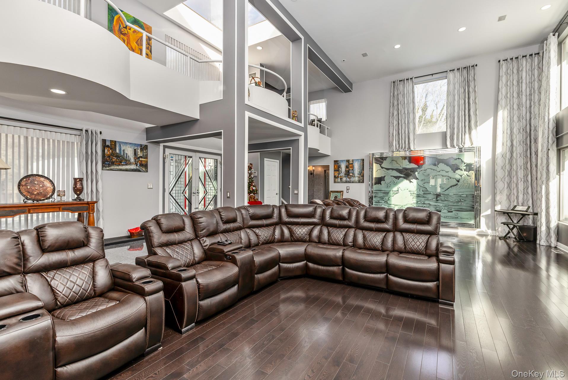 83 Cliff Road Port Jefferson, NY 11777 - Photo 23 of 50 a living room with furniture and a large window