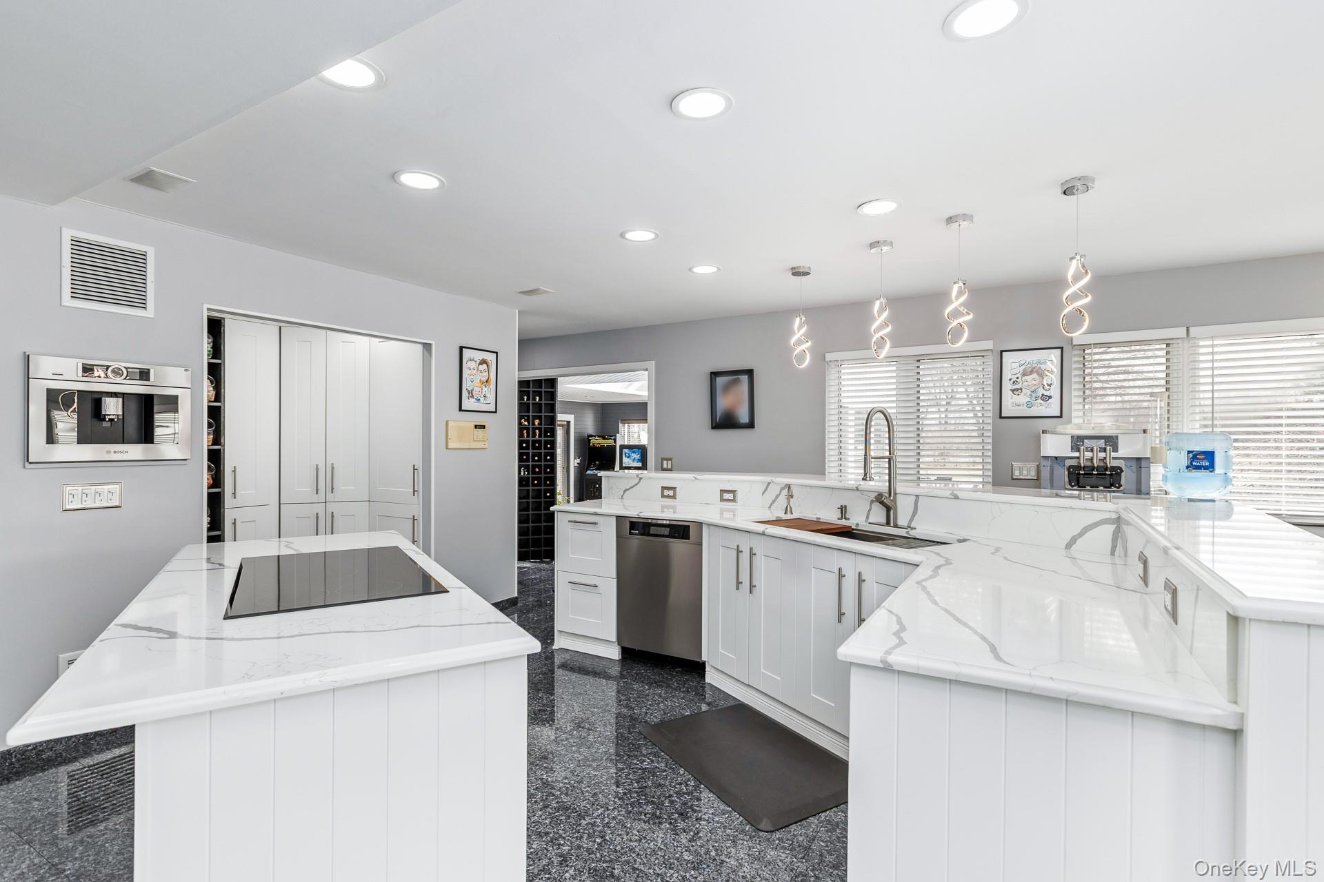 83 Cliff Road Port Jefferson, NY 11777 - Photo 31 of 50 a kitchen with sink and refrigerator