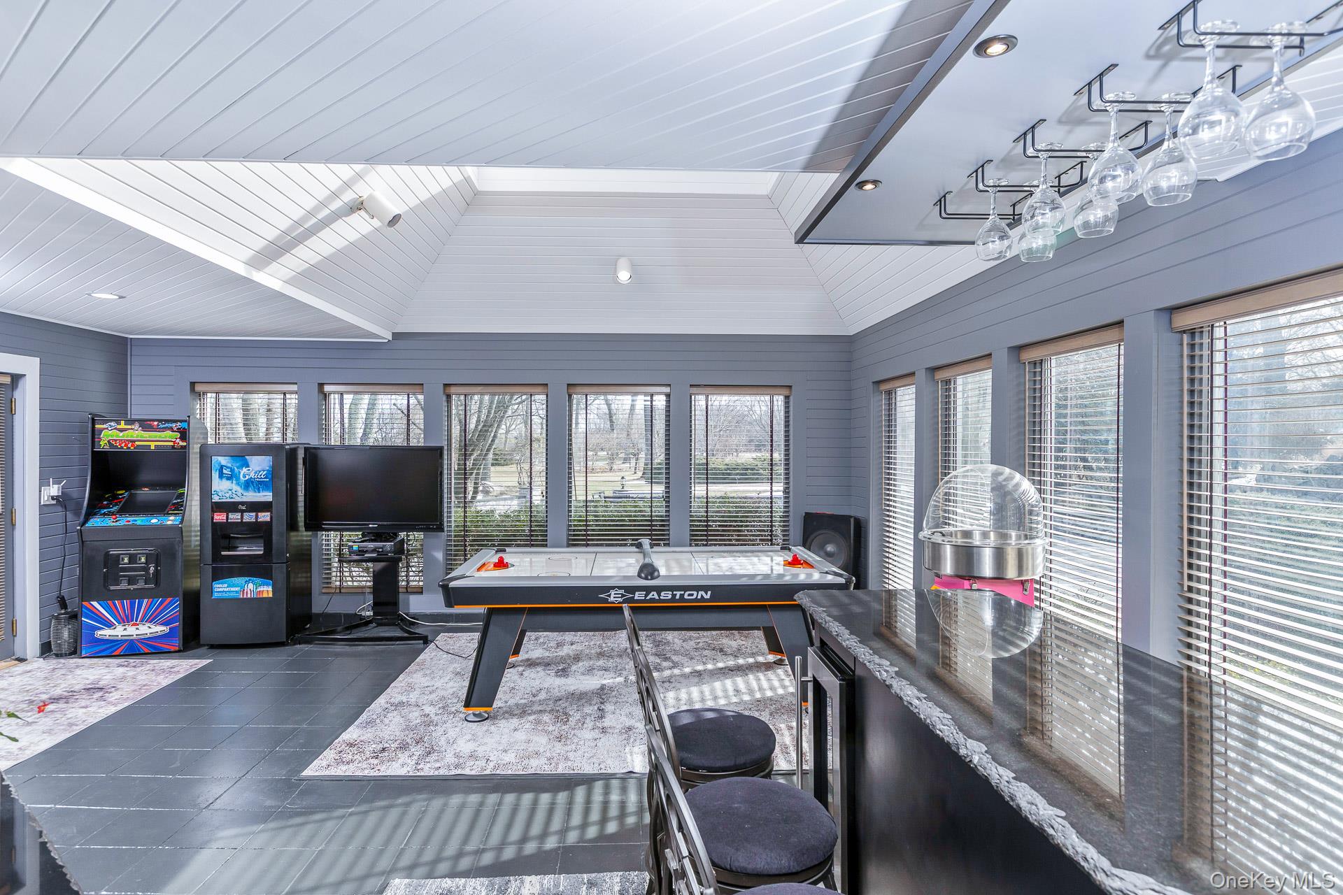 83 Cliff Road Port Jefferson, NY 11777 - Photo 32 of 50 a living room with furniture large window and flat screen tv