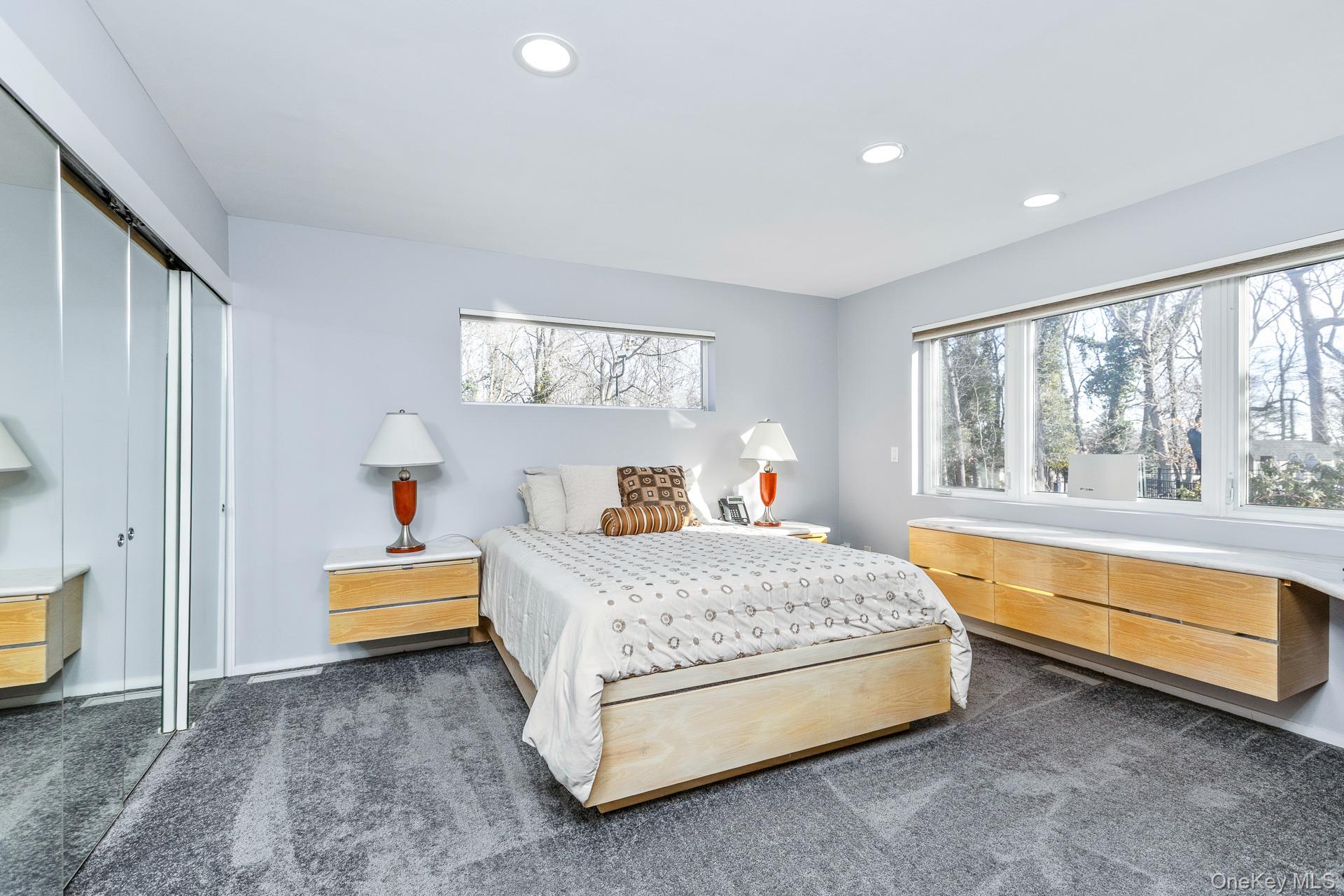 83 Cliff Road Port Jefferson, NY 11777 - Photo 37 of 50 a bedroom with a bed and a window