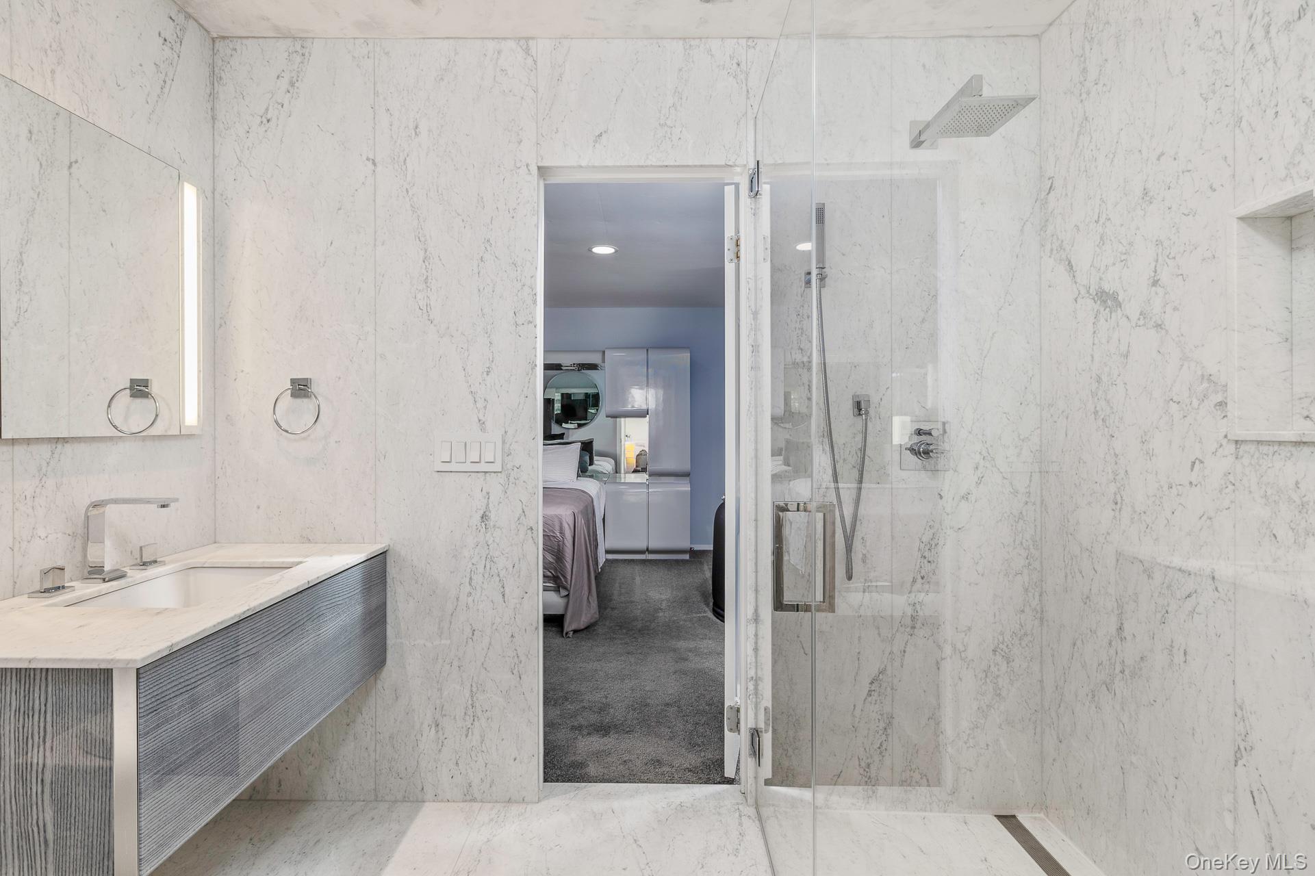 83 Cliff Road Port Jefferson, NY 11777 - Photo 38 of 50 a bathroom with a sink shower and a mirror