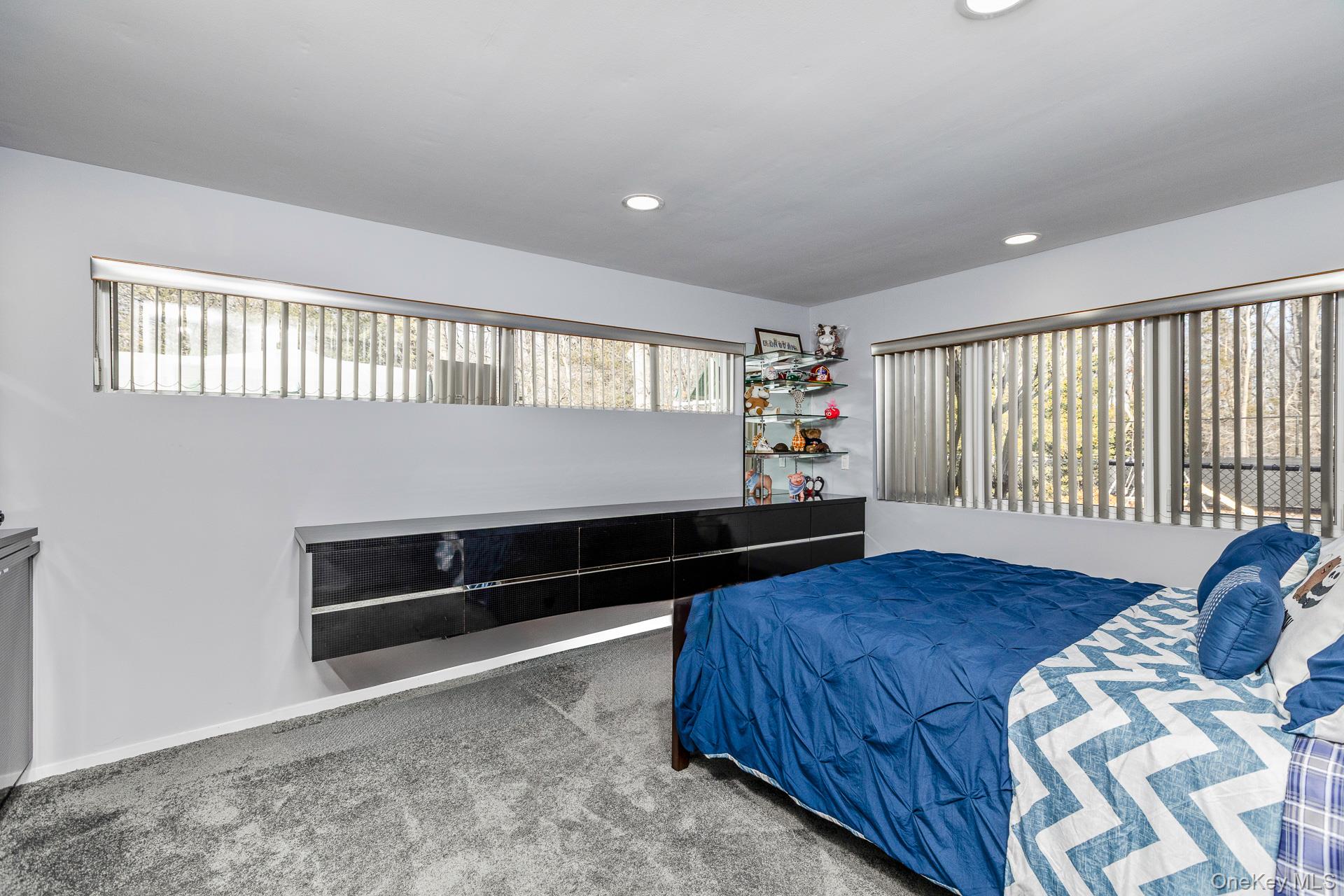 83 Cliff Road Port Jefferson, NY 11777 - Photo 40 of 50 a bedroom with bed and window