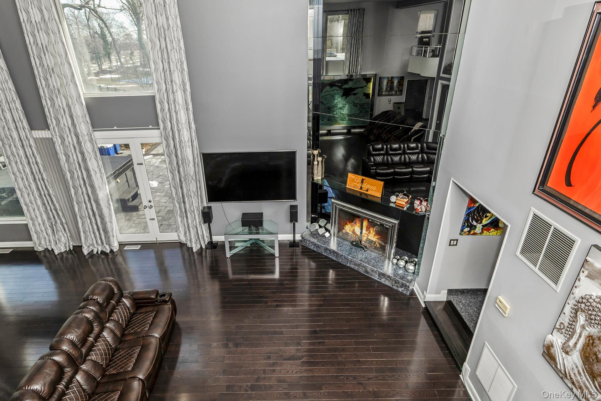 83 Cliff Road Port Jefferson, NY 11777 - Photo 41 of 50 a living room with furniture and a flat screen tv