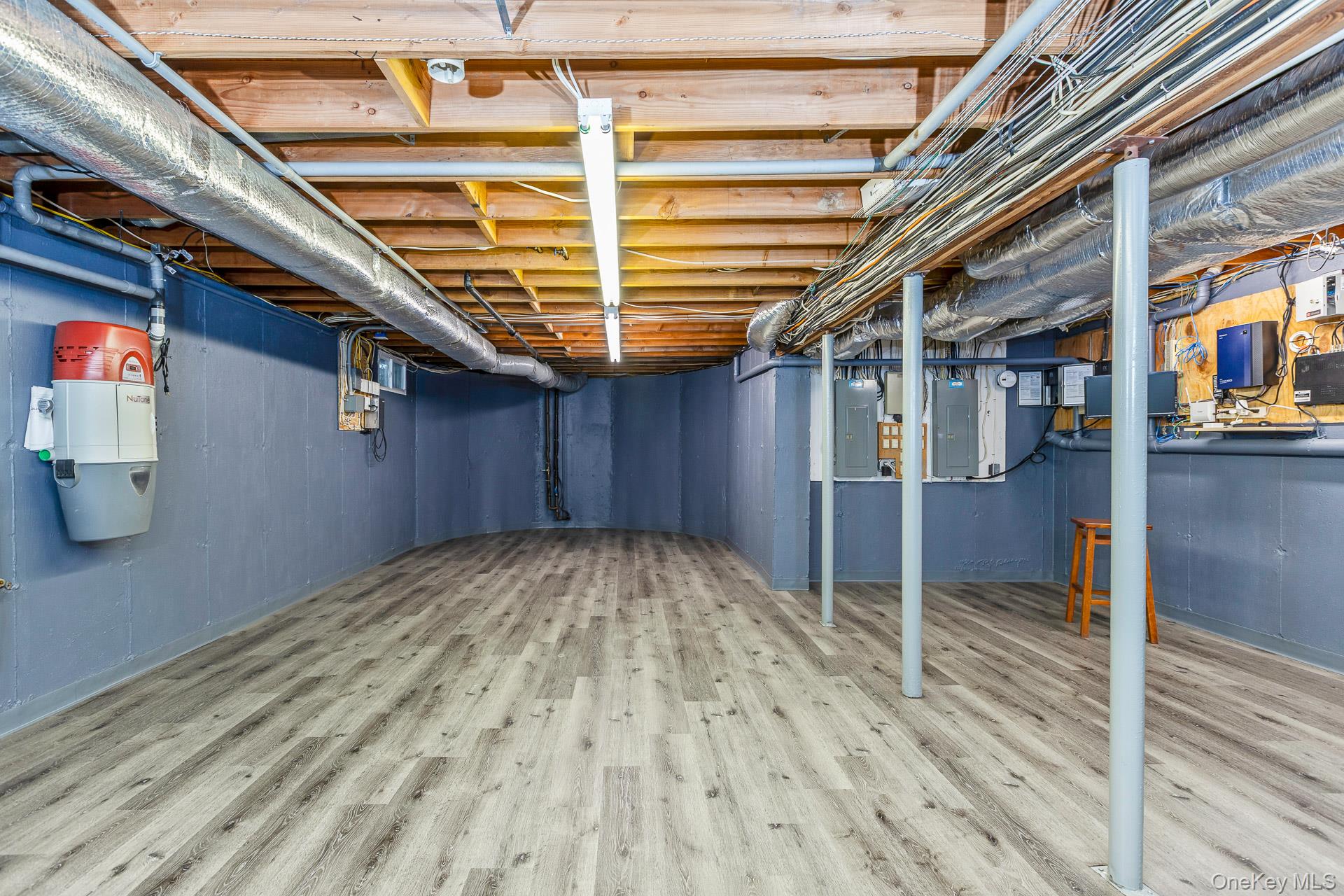 83 Cliff Road Port Jefferson, NY 11777 - Photo 47 of 50 a view of an empty room with wooden floor