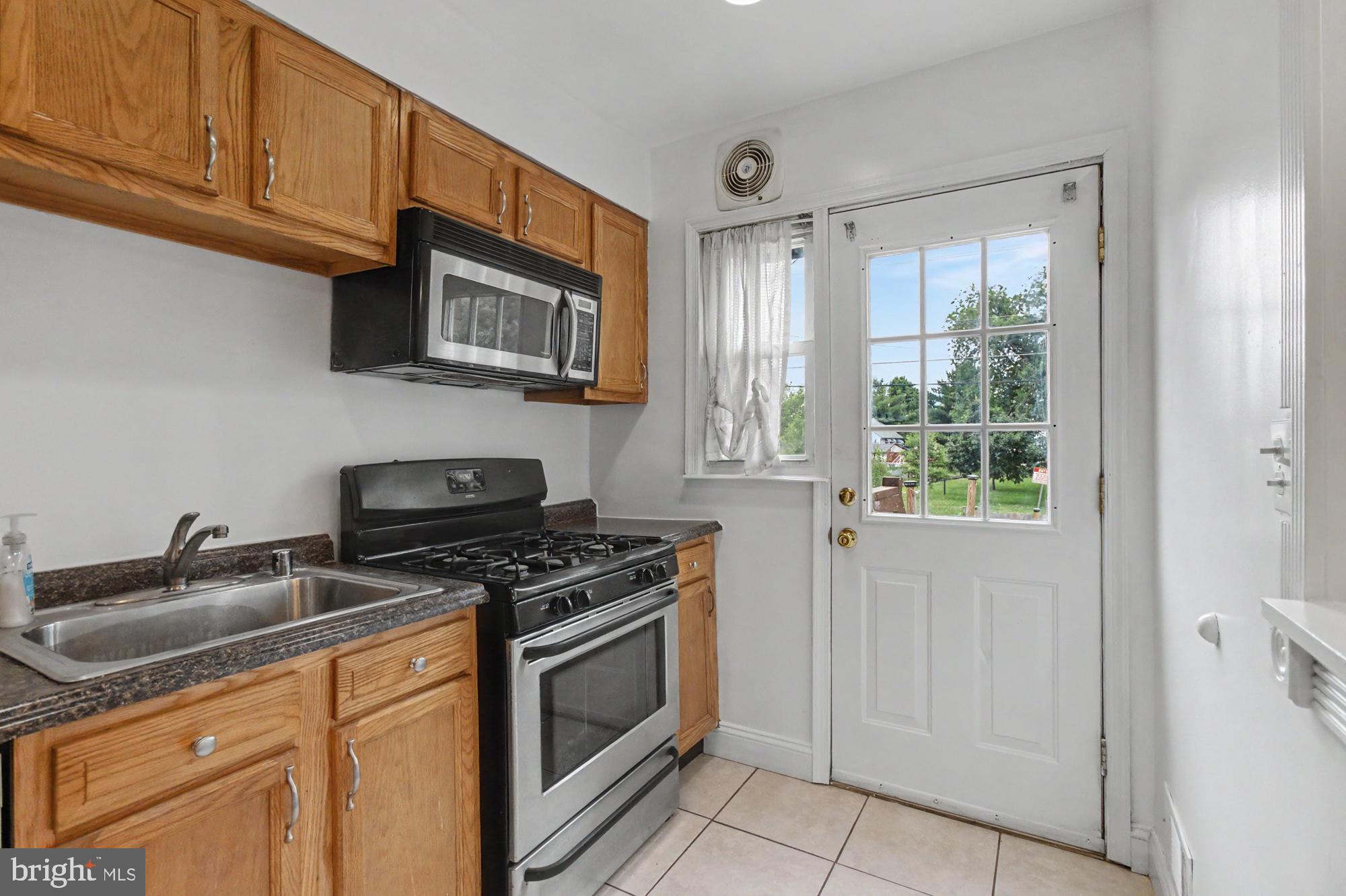 8218 Kavanagh Road Dundalk, MD 21222 - Photo 15 of 39 Bright kitchen with outdoor access.