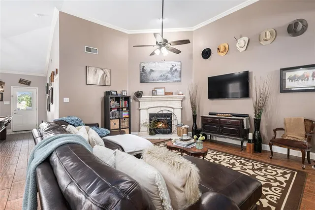 a living room with furniture and a fireplace
