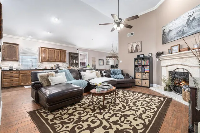 a kitchen with stainless steel appliances granite countertop wooden cabinets stove top oven and sink
