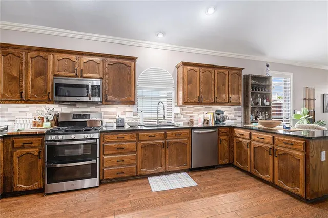 a room with pool table and windows