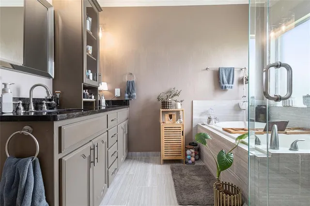 a bathroom with a bathtub and a shower