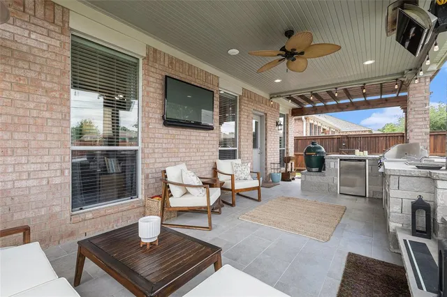 a view of a chairs and table in backyard of the house