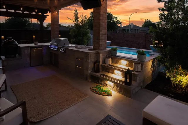 a view of a backyard with sitting area