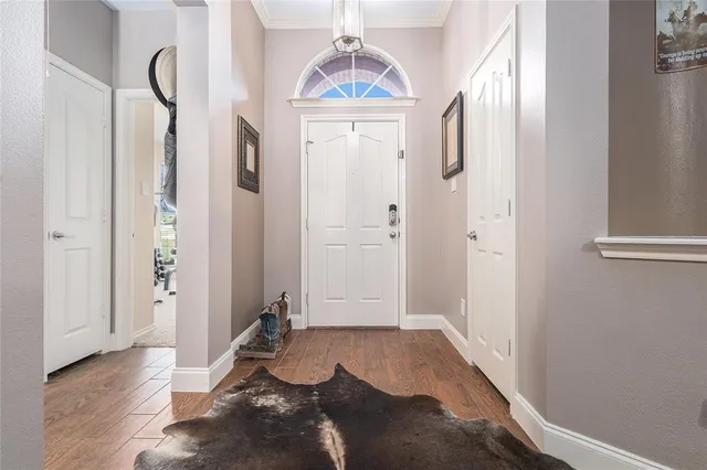 a living room with furniture and painting on the wall