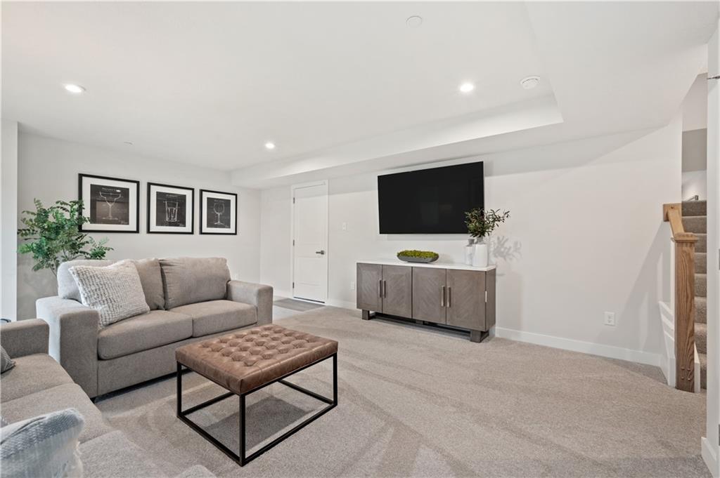 227 Elk Rdg Drive Moon Township, PA 15108 - Photo 18 of 19 a living room with furniture and a flat screen tv
