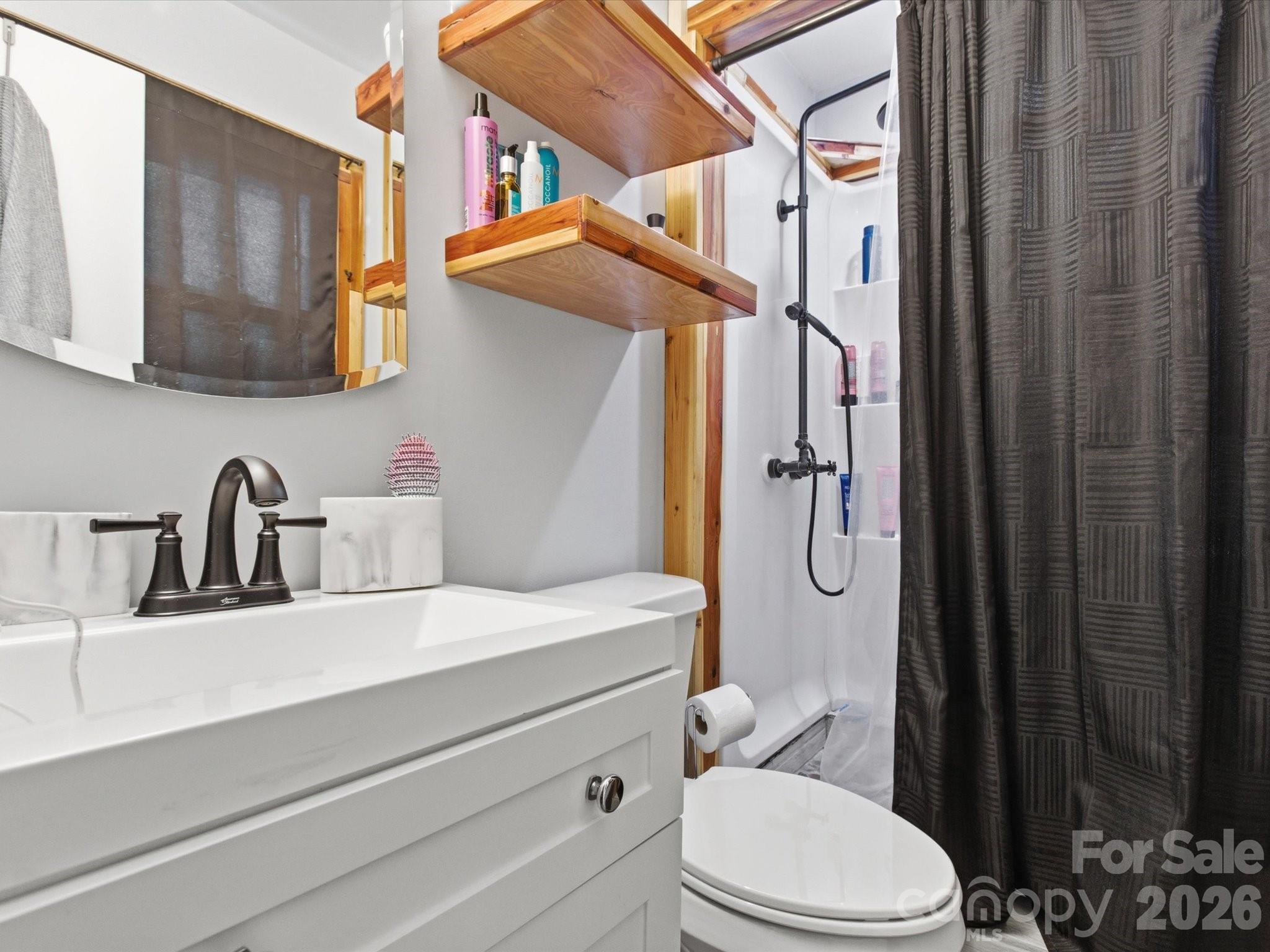 2694 Pineview Drive Lancaster, SC 29720 - Photo 17 of 26 a bathroom with a sink a toilet and shower