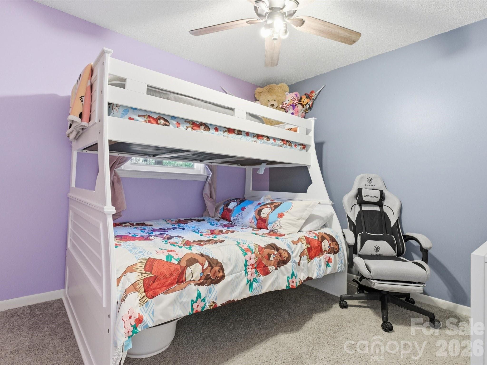 2694 Pineview Drive Lancaster, SC 29720 - Photo 19 of 26 a bedroom with a bed and a chandelier