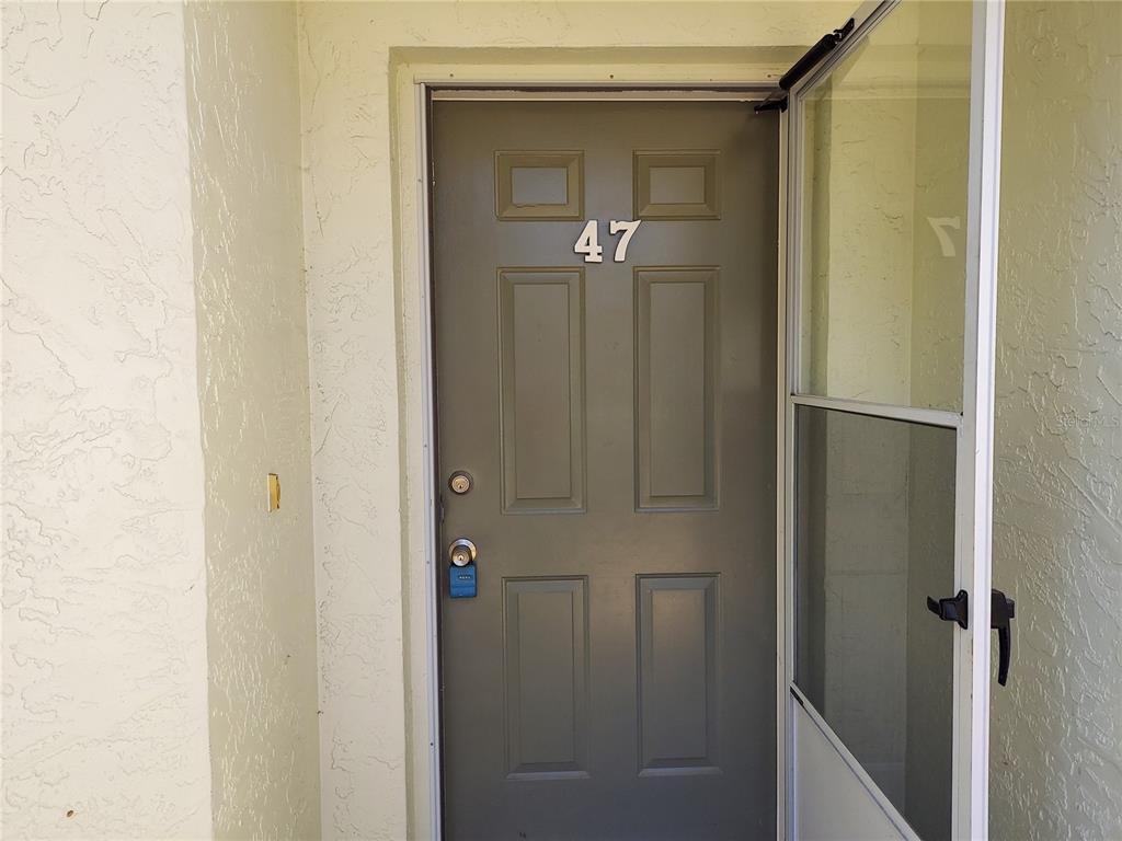 47 Lake Forest Place, Unit 47 Palm Coast, FL 32137 - Photo 2 of 12 a bathroom with a glass door shower