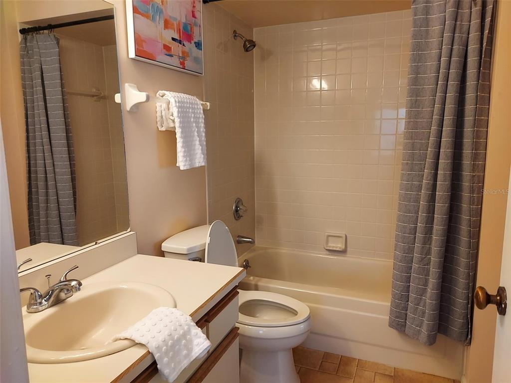 47 Lake Forest Place, Unit 47 Palm Coast, FL 32137 - Photo 9 of 12 a bathroom with a sink toilet and shower