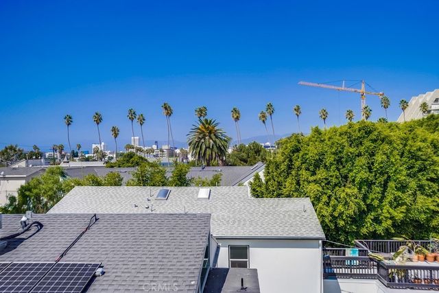 a view of a patio with table and chairs with wooden floor and fence