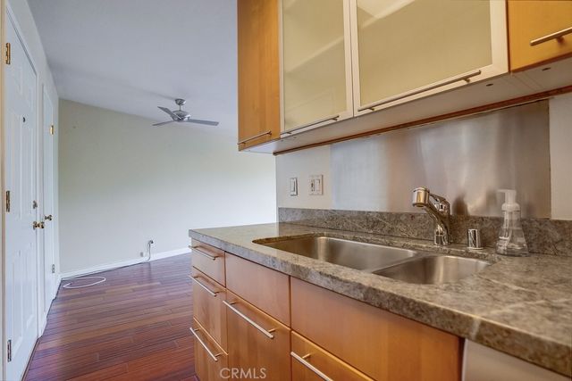 a kitchen with a sink and cabinets