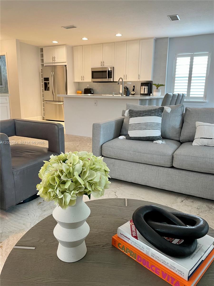 3081 Matilda Street, Unit A Miami, FL 33133 - Photo 4 of 14 a living room with furniture and a potted plant