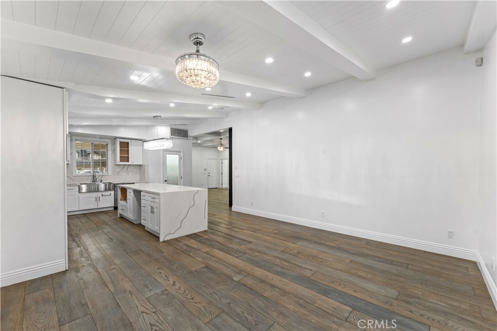 6418 Ringsdale Court Bakersfield, CA 93313 - Photo 20 of 59 a view of kitchen and hall with wooden floor
