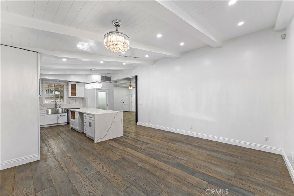 6418 Ringsdale Court Bakersfield, CA 93313 - Photo 22 of 59 a view of kitchen and hall with wooden floor