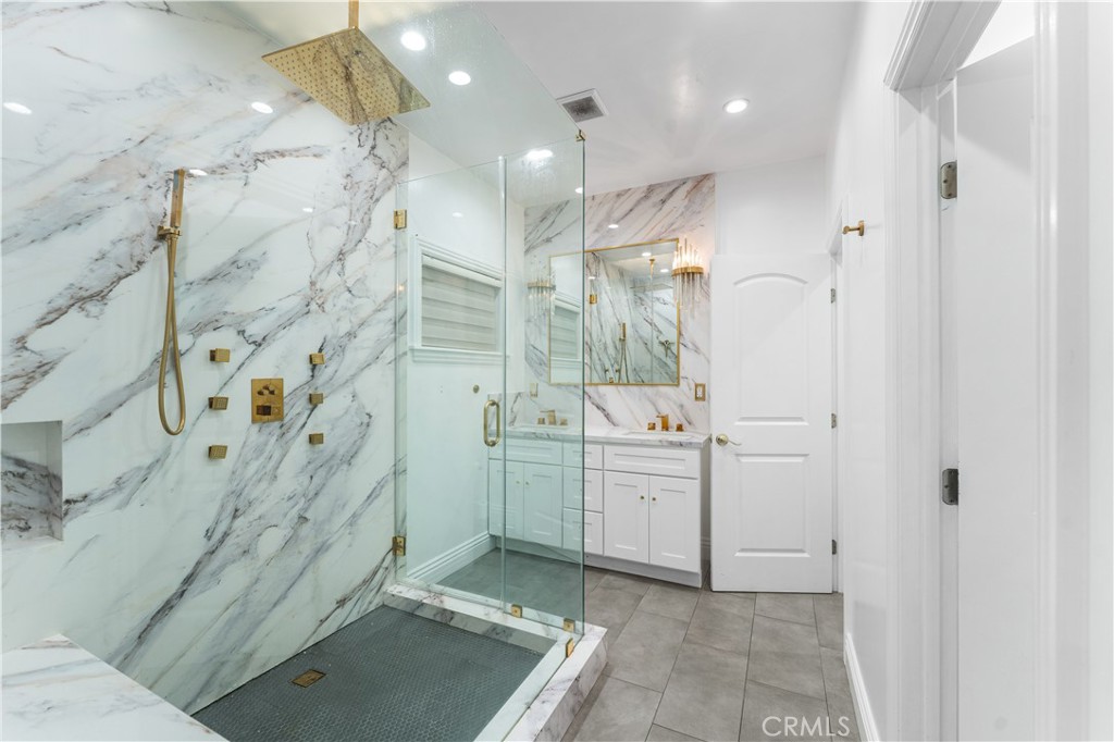 6418 Ringsdale Court Bakersfield, CA 93313 - Photo 29 of 59 a bathroom with a sink a toilet and shower