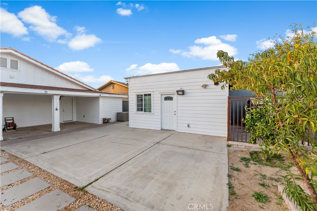 6418 Ringsdale Court Bakersfield, CA 93313 - Photo 45 of 59 a view of a house with a yard and garage