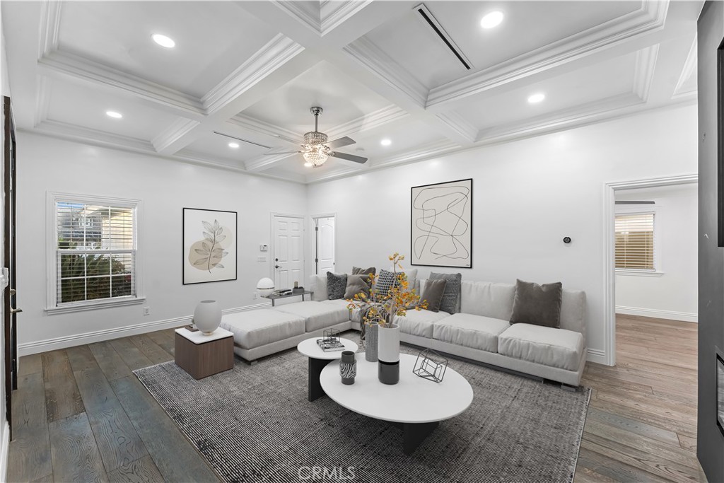 6418 Ringsdale Court Bakersfield, CA 93313 - Photo 5 of 59 a living room with furniture and a chandelier