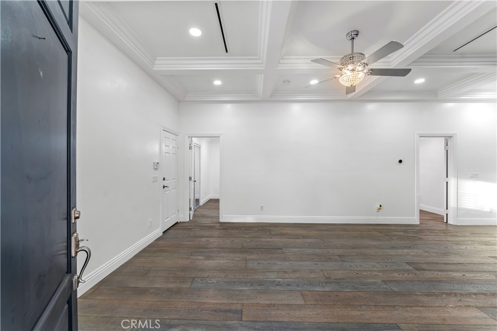6418 Ringsdale Court Bakersfield, CA 93313 - Photo 7 of 59 a view of an empty room with wooden floor