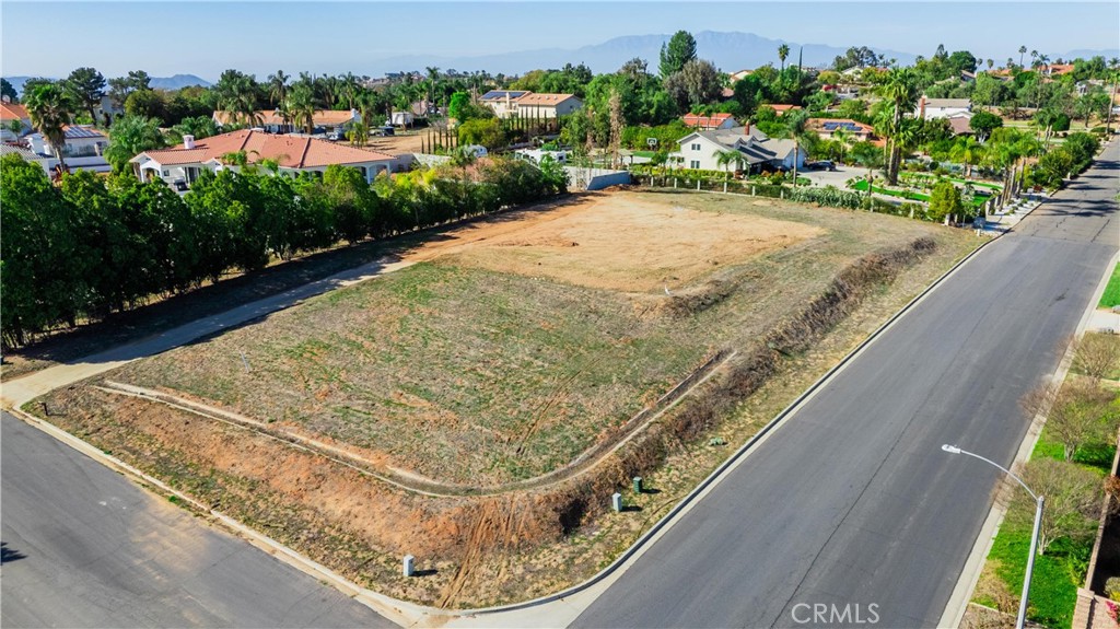 16460 Landon Court Riverside, CA 92504 - Photo 2 of 18 a view of a swimming pool with a yard and plants