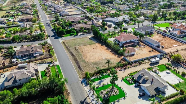 an aerial view of multiple houses with yard