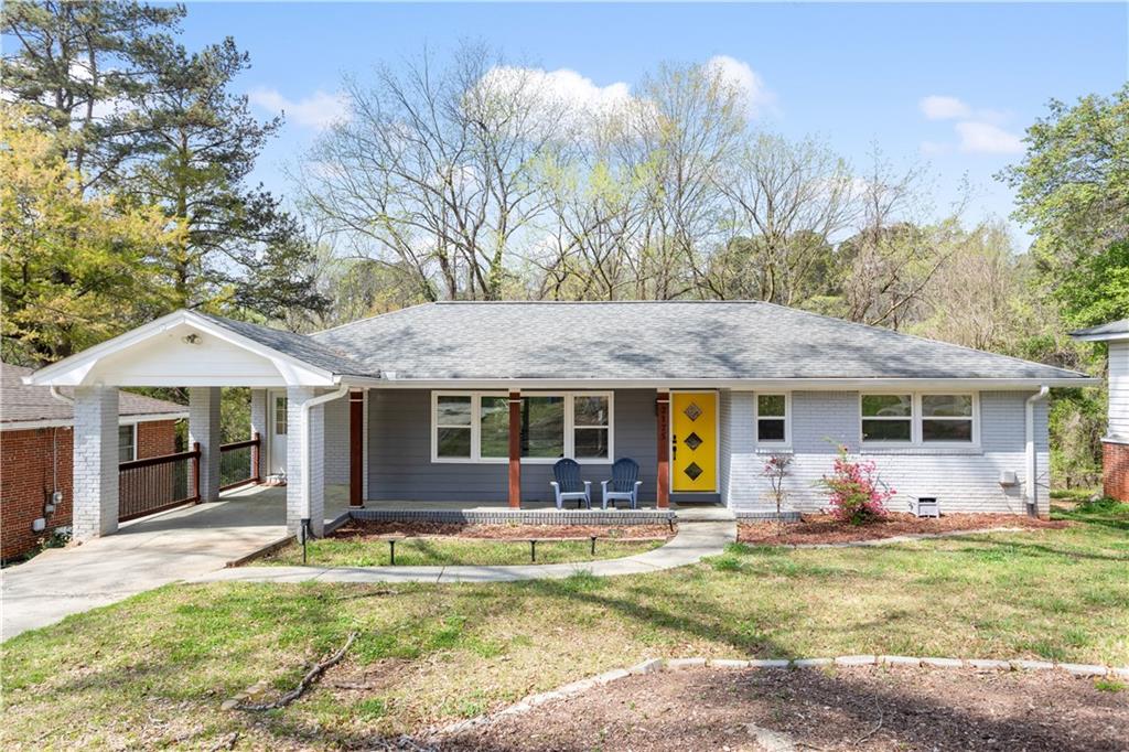 a view of a house with backyard porch and furniture