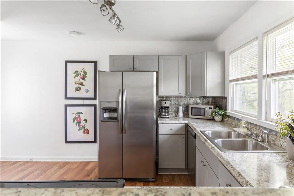 2175 Glendale Drive Decatur, GA 30032 - Photo 11 of 21 a kitchen with stainless steel appliances granite countertop a refrigerator sink and stove
