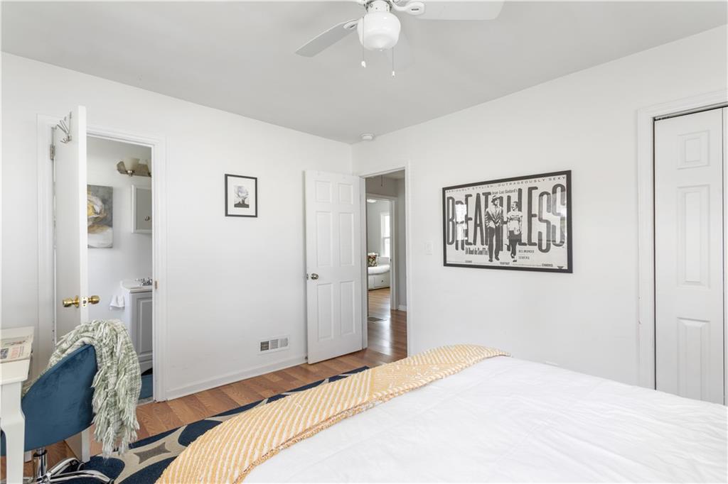 2175 Glendale Drive Decatur, GA 30032 - Photo 14 of 21 a bedroom with a bed and a chandelier
