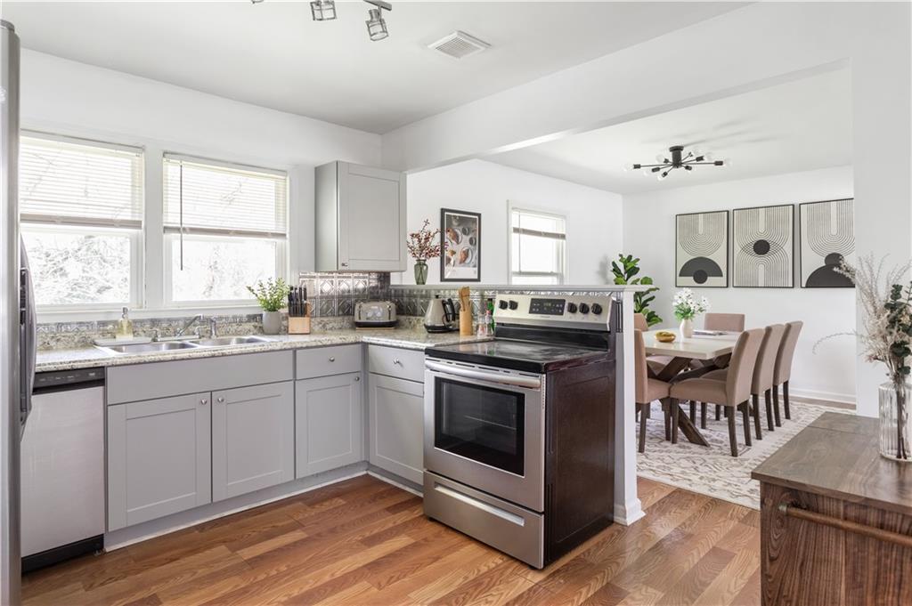 2175 Glendale Drive Decatur, GA 30032 - Photo 8 of 21 a kitchen with a stove a sink and a refrigerator