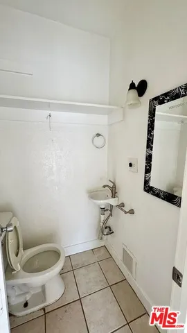 a bathroom with a toilet and a sink