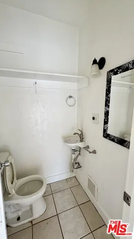 a bathroom with a toilet and a sink