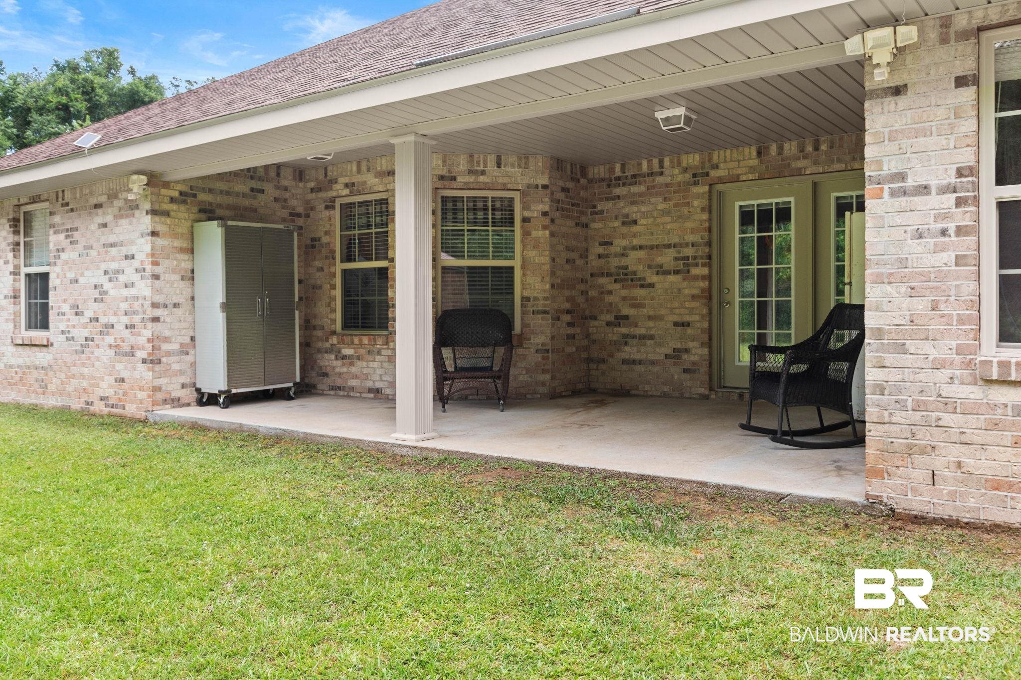 16151 Tolbert Road Bay Minette, AL 36507 - Photo 64 of 74 Covered patio featuring a concrete slab and brick exterior