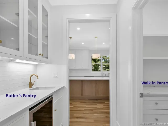a kitchen with stainless steel appliances granite countertop a sink and a stove